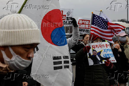 Pro-Yoon supporters participate in a rally outside the Seoul Detention Center in Uiwang