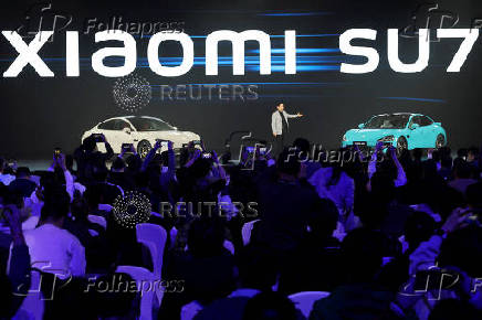 FILE PHOTO: CEO Lei Jun unveils Xiaomi's first electric vehicle, the SU7, in Beijing, China