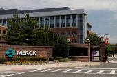 FILE PHOTO: The Merck logo is seen at a gate to the Merck & Co campus in Rahway, New Jersey, New Jersey