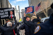 People protest near the Manhattan Criminal Court in New York City