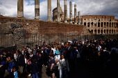 Tourists visit Colosseum area in Rome