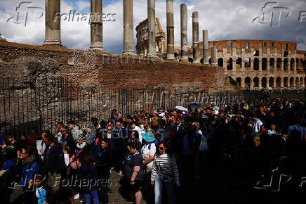 Tourists visit Colosseum area in Rome