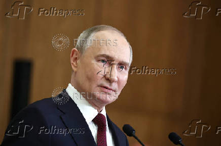 Russian President Putin attends a press conference in Astana