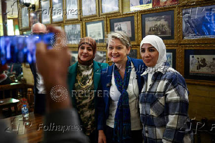 Britain's Home Secretary Yvette Cooper poses for photographs, in Baghdad