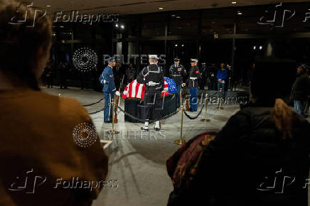 Mourners view the casket of former President Jimmy Carter in Atlanta