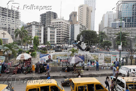 People walk on Broad Street in Lagos