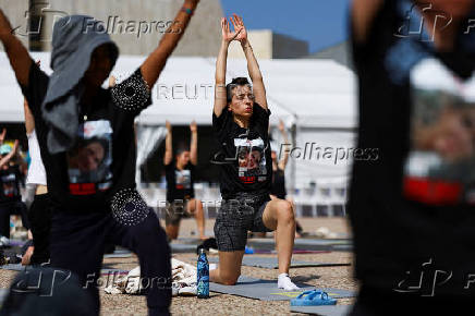 People practice yoga in support of Israeli hostages held in Gaza, in Tel Aviv