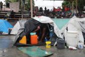 People displaced by gang violence shelter at a school, in Port-au-Prince