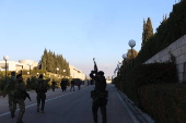 Celebrations in Damascus after rebels capture the city and overthrow al-Assad