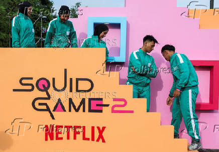 Players attend an event with the Red Light, Green Light game at Gelora Bung Karno Stadium ahead of the release of the Netflix series Squid Game: Season 2 in Jakarta