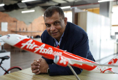 FILE PHOTO: Tony Fernandes, the CEO of AirAsia's parent company, Capital A, attends an interview with Reuters in Sepang