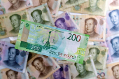 FILE PHOTO: Illustration shows Russian Rouble and Chinese Yuan banknotes
