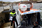 People vote in Ireland's general election, on the island of Gola