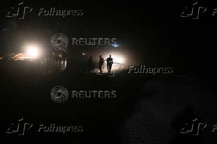 Israeli soldiers work after returning from Lebanon, following a ceasefire between Israel and Iran-backed group Hezbollah, near Kiryat Shmona