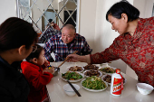Yang during a meal at her apartment in a town bordering Beijing