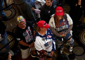 Supporters wait in line to see Republican vice presidential nominee JD Vance and Robert F. Kennedy Jr. take part in a moderated discussion with actor Zachary Levi in Dearborn