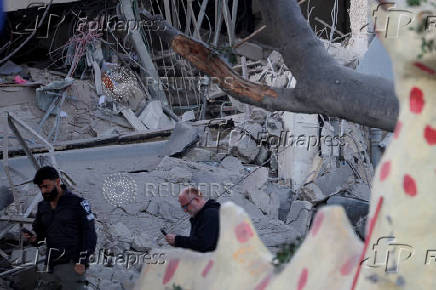 Scenes from a damaged site after a projectile fired from Yemen was intercepted, in Ramat Gan