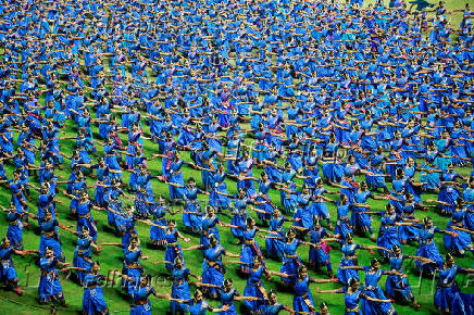 Participants wearing colourful attire, perform Bharatanatyam dance at the Jawaharlal Nehru International Stadium, in Kochi