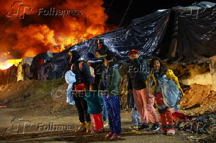 Mexican authorities carry out an operation to remove migrants from a camp in Chihuahua