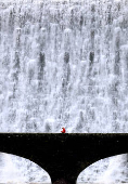 Water flows over the Caban Coch Dam in the Elan Valley