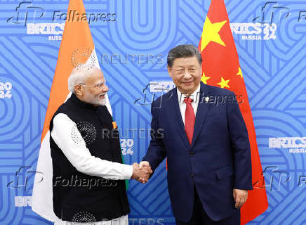 Chinese President Xi and India Prime Minister Modi meet in Kazan