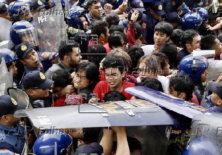 Protesters mark the 161th birth anniversary of hero Andres Bonifacio