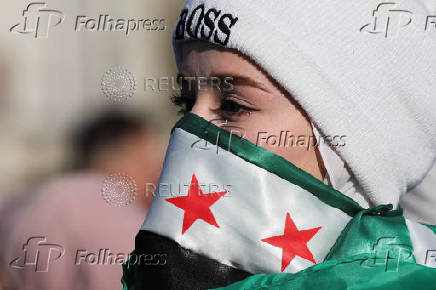 People gather after Syria's Bashar al-Assad was ousted in central Damascus