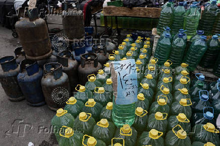 Containers filled with fuel sold on the black market in Damascus