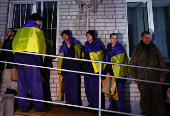 Ukrainian prisoners of war (POWs) return after a swap, in an undisclosed location