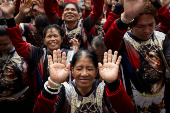 Filipino Catholics participate in the parade of Black Nazarene replicas