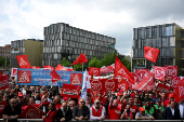 FILE PHOTO: Thyssenkrupp steelworkers rally at an IG Metall union protest in Essen