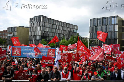 FILE PHOTO: Thyssenkrupp steelworkers rally at an IG Metall union protest in Essen