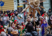 People dressed in traditional Ukrainian costumes attend a Christmas celebration in Lviv