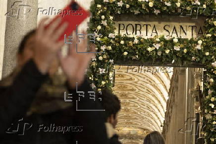 People walk through the Holy Door at Rome's Basilica of Saint Mary Major