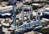 Guests walk in the Kennedy Space Center Visitor's Center's 'Rocket Garden' at the Kennedy Space Center in Cape Canaveral