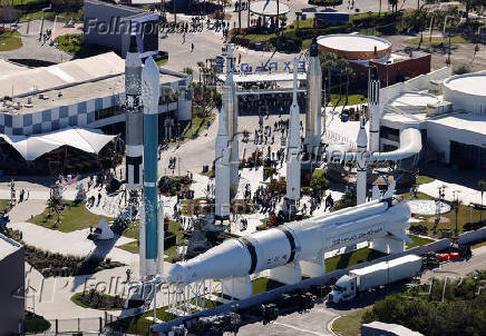 Guests walk in the Kennedy Space Center Visitor's Center's 'Rocket Garden' at the Kennedy Space Center in Cape Canaveral