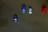 A drone view shows stranded vehicles at White Mills Marina after heavy rain and flooding in Northampton