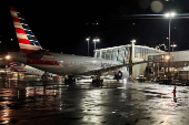 FILE PHOTO: An American Airlines plane sits at a gate at Logan Airport ahead of the July 4th holiday in Boston