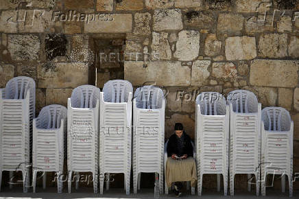 Jewish worshippers pray at the Western Wall in the Old City of Jerusalem