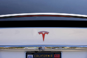 FILE PHOTO: A Tesla Model X is shown at a Tesla service center in Costa Mesa, California