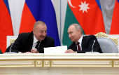 Russian President Putin and Azeri President Aliyev meet with railway workers in Moscow