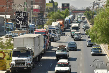 Vehicles wait in line to refuel with diesel, in Cochabamba