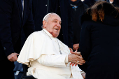 Pope Francis boards the papal plane for his apostolic visit to Corsica, at Fiumicino airport