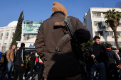 Former members of Syria's Bashar Al Assad's security forces wait to register for the identification and reconciliation process, in Damascus