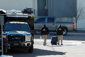 Investigators search a townhouse, in relation to the explosion in Las Vegas of a Tesla Cybertruck