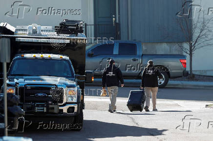 Investigators search a townhouse, in relation to the explosion in Las Vegas of a Tesla Cybertruck