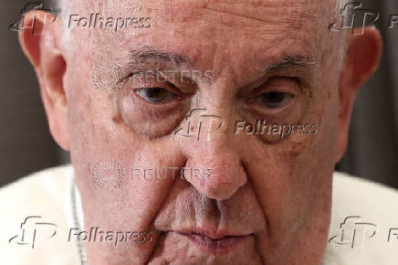 FILE PHOTO: Pope Francis holds a news conference aboard the papal plane