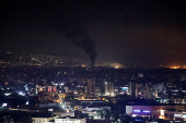 Smoke billows over Beirut's southern suburbs, as seen from Sin El Fil