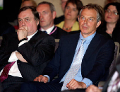 FILE PHOTO: Former Labour Party Deputy Leader Prescott and Prime Minister Blair listen to incoming Prime Minister Brown's speech during the Labour Leadership Conference in northern England