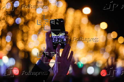 Paris Olympics chief Estanguet turns on Christmas lights on the Champs Elysees